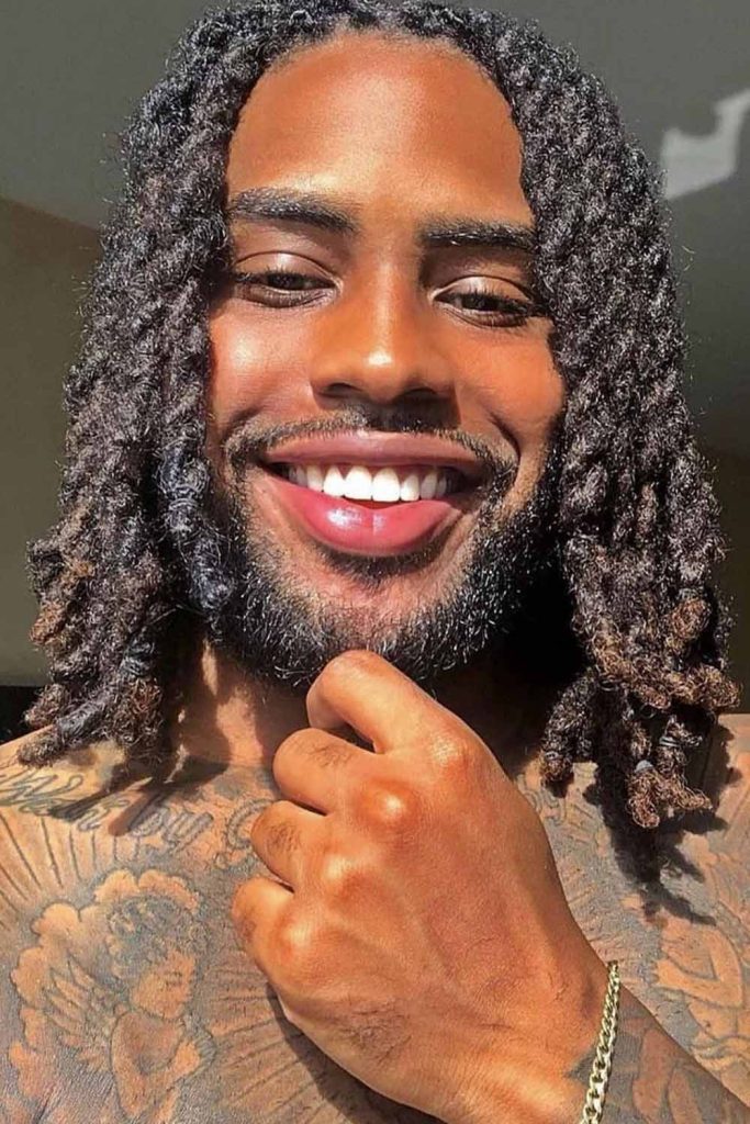 Radiant smile with Loose Dreadlocks