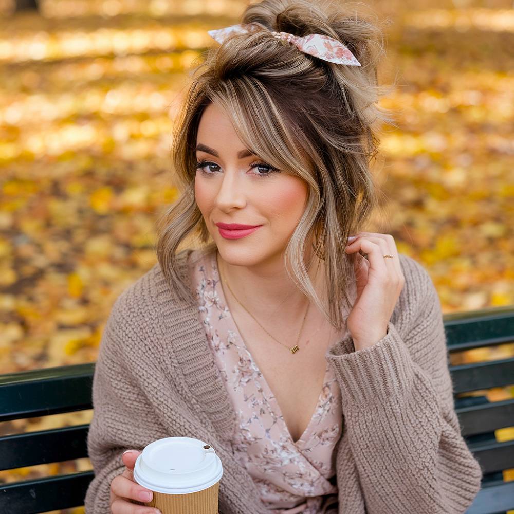 Textured messy bun secured with floral ribbon scrunchie, casual ribbon hairstyle for shoulder-length hair